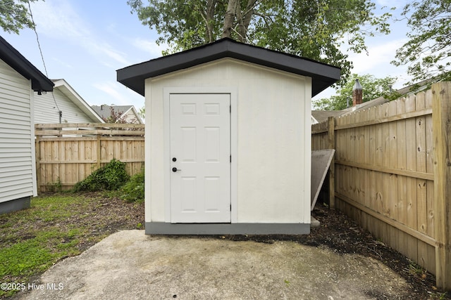 view of shed with a fenced backyard