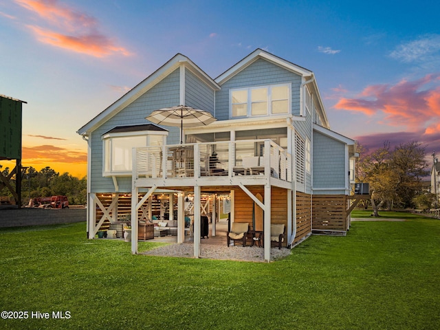 267 Live Oak Rd, Newport, NC 28570 - back of property featuring a patio area, a lawn, a wooden deck, and outdoor lounge area