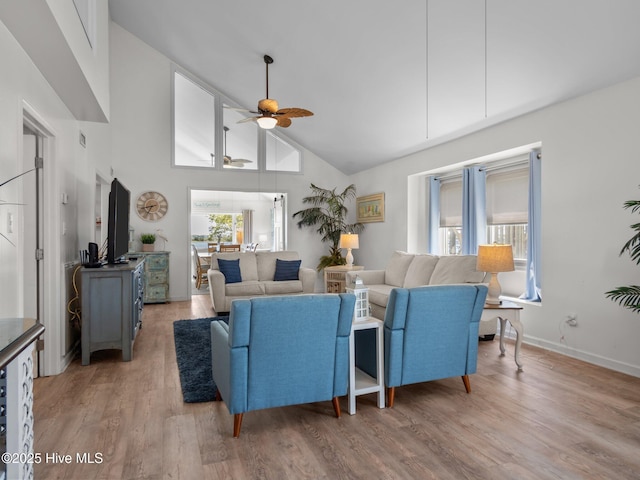 267 Live Oak Rd, Newport, NC 28570 - living room featuring a ceiling fan, high vaulted ceiling, light wood-style floors, and baseboards