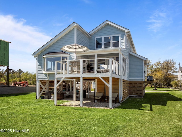 267 Live Oak Rd, Newport, NC 28570 - rear view of house featuring a deck, a yard, a patio, and a sunroom