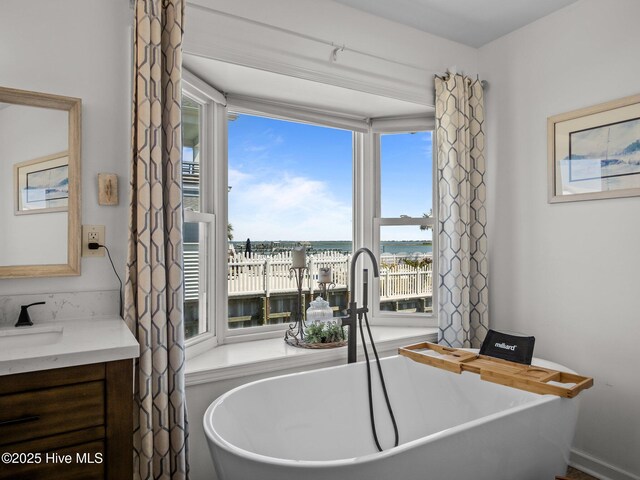 267 Live Oak Rd, Newport, NC 28570 - full bath with vanity, a soaking tub, and a water view