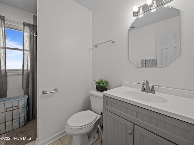 267 Live Oak Rd, Newport, NC 28570 - bathroom with toilet, vanity, and baseboards