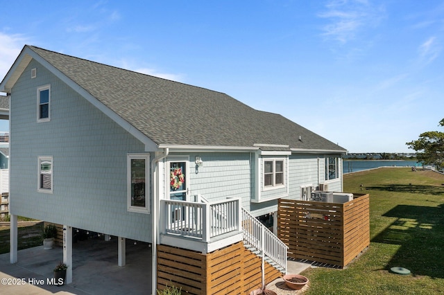 267 Live Oak Rd, Newport, NC 28570 - back of property featuring roof with shingles, a yard, and a carport