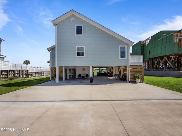 267 Live Oak Rd, Newport, NC 28570 - rear view of house featuring a carport and concrete driveway