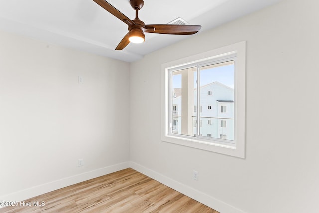 1800 Canal Dr Unit 309, Carolina Beach, NC 28428 - empty room with baseboards, ceiling fan, and light wood finished floors