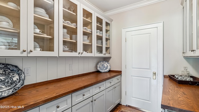 interior space with crown molding