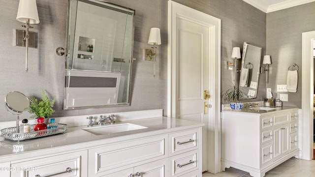 bathroom with crown molding, vanity, and tiled shower