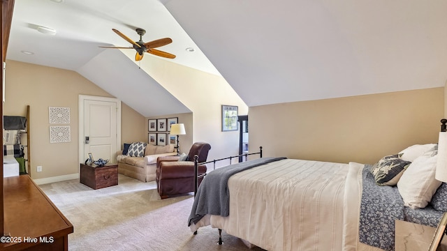 bedroom featuring light carpet, vaulted ceiling, baseboards, and a ceiling fan