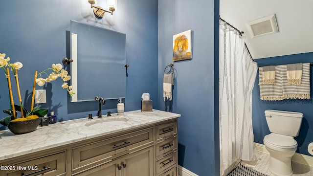 bathroom featuring tile patterned floors, toilet, visible vents, baseboards, and vanity