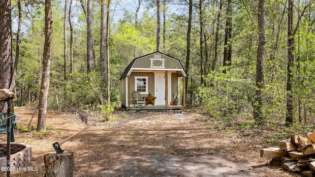 view of shed with a view of trees