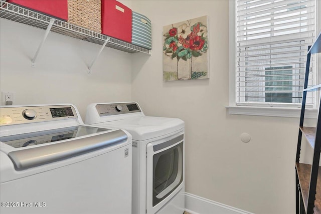 467 Kerr Lake Rd, Aberdeen, NC 28315 - laundry area featuring washing machine and clothes dryer and baseboards