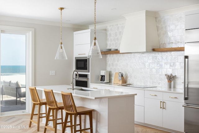 kitchen featuring backsplash, a sink, and open shelves