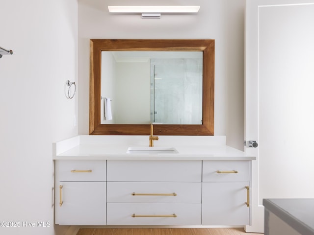 full bath with vanity and a shower