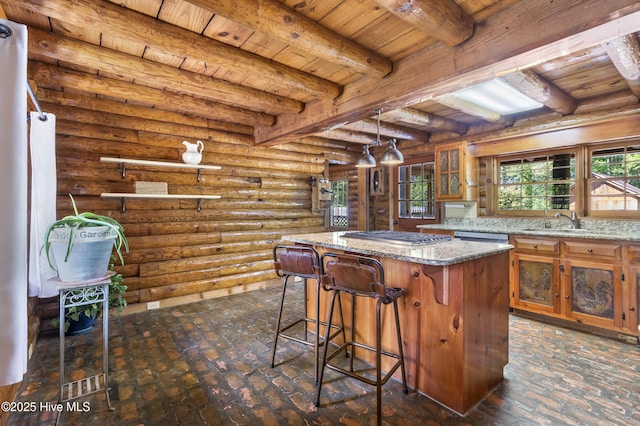 kitchen featuring a kitchen island, wooden ceiling, and a wealth of natural light