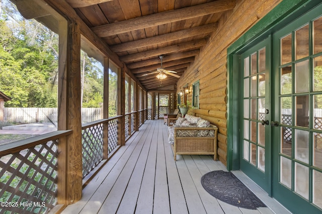 deck featuring ceiling fan, french doors, and fence