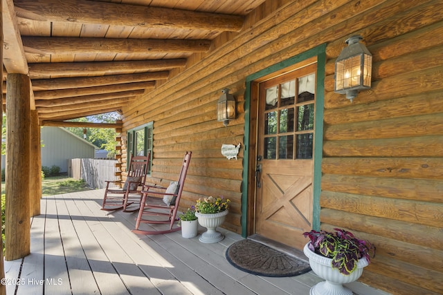 doorway to property featuring a porch