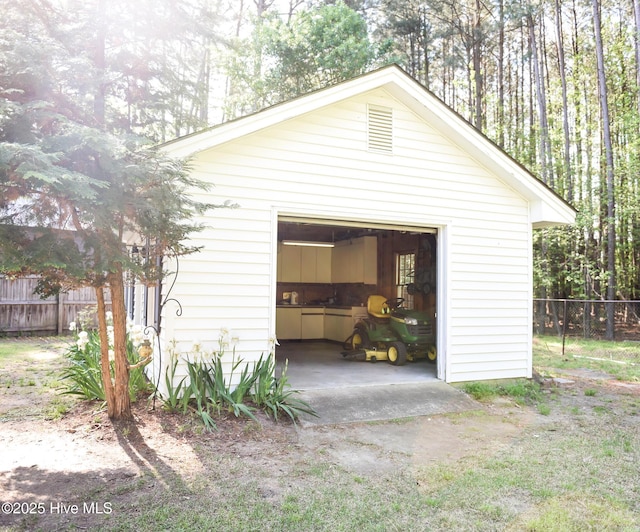detached garage with fence