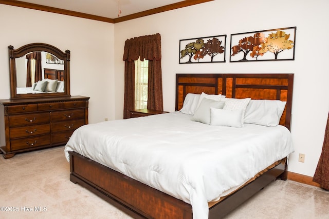 bedroom with light colored carpet, baseboards, and ornamental molding