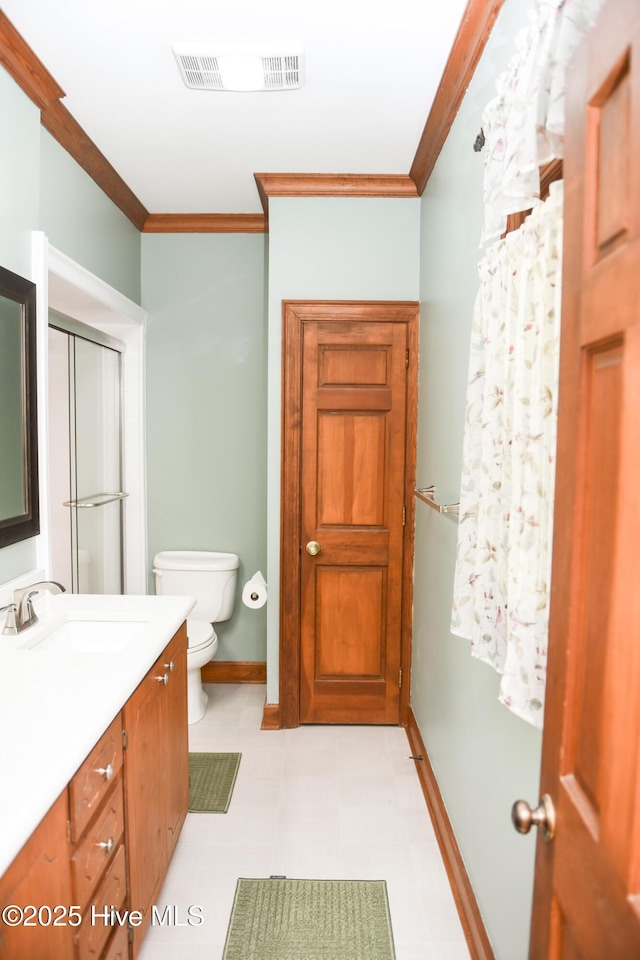 full bath featuring tile patterned floors, toilet, visible vents, vanity, and ornamental molding