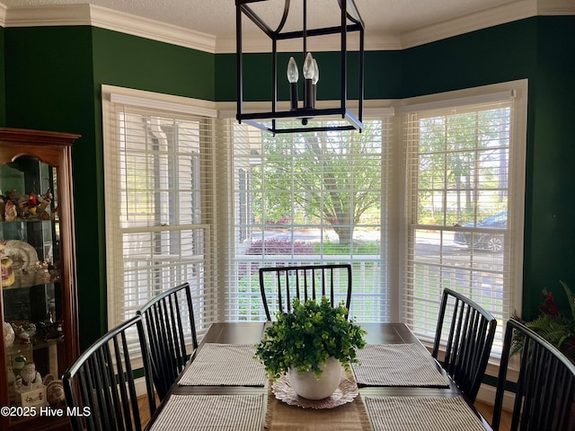 dining space with crown molding