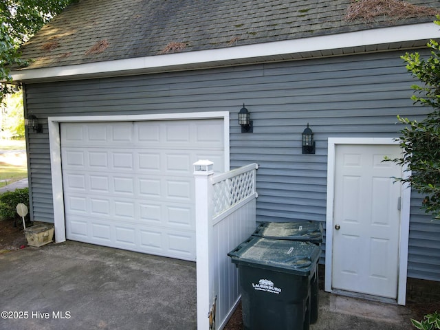 garage featuring driveway