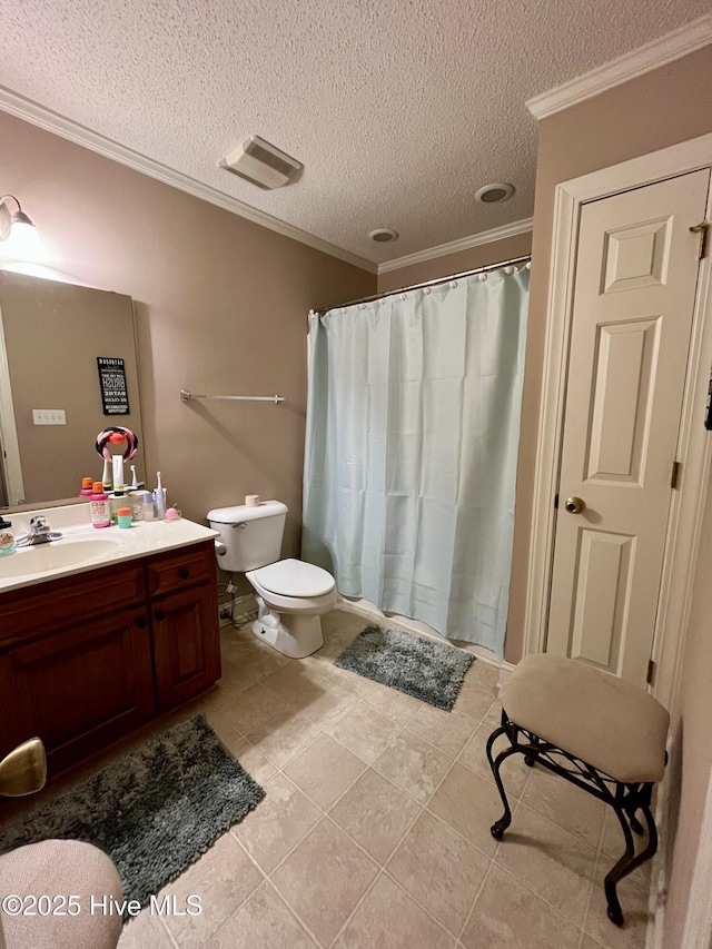 bathroom with tile patterned floors, a textured ceiling, toilet, vanity, and ornamental molding