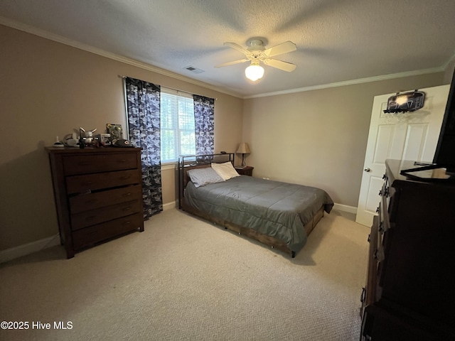 bedroom with ornamental molding, visible vents, and light colored carpet