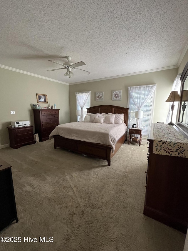 carpeted bedroom with a ceiling fan, a textured ceiling, and ornamental molding