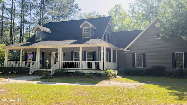 view of front of house with a porch and a front yard