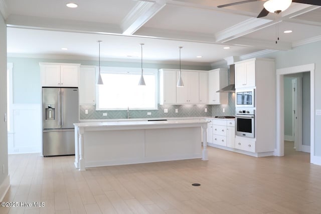 3347 Island Lakes Dr, Oak Island, NC 28461 - kitchen featuring wall chimney exhaust hood, stainless steel appliances, ceiling fan, light countertops, and a kitchen island