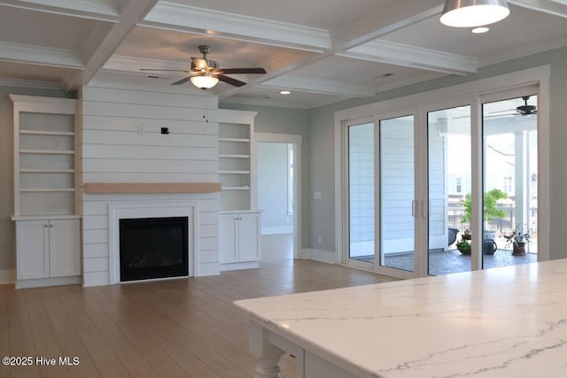 3347 Island Lakes Dr, Oak Island, NC 28461 - unfurnished living room with coffered ceiling, a ceiling fan, crown molding, baseboards, and light wood-style flooring