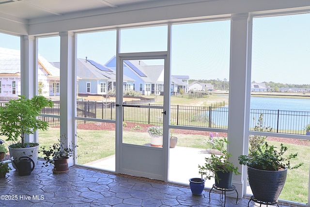 3347 Island Lakes Dr, Oak Island, NC 28461 - sunroom with a residential view