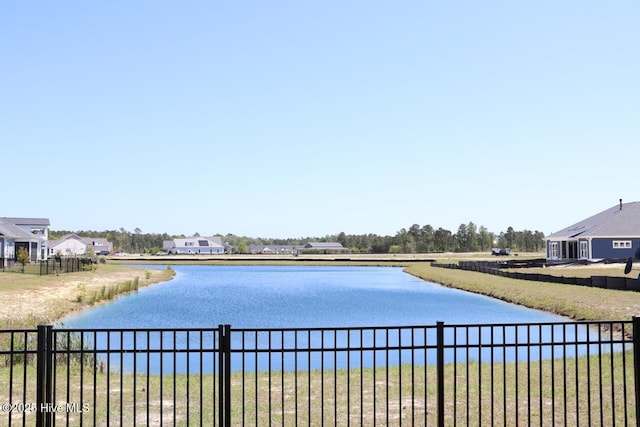 3347 Island Lakes Dr, Oak Island, NC 28461 - view of water feature with fence
