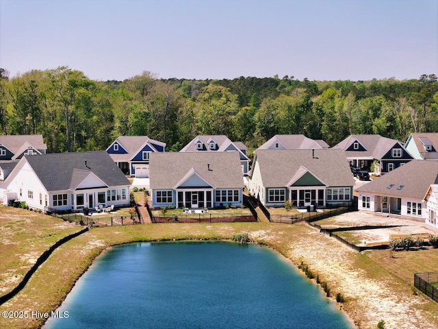 3347 Island Lakes Dr, Oak Island, NC 28461 - birds eye view of property with a view of trees, a water view, and a residential view