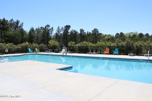 3347 Island Lakes Dr, Oak Island, NC 28461 - pool featuring fence and a patio area