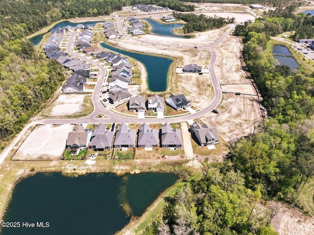 3347 Island Lakes Dr, Oak Island, NC 28461 - aerial view featuring a residential view and a water view