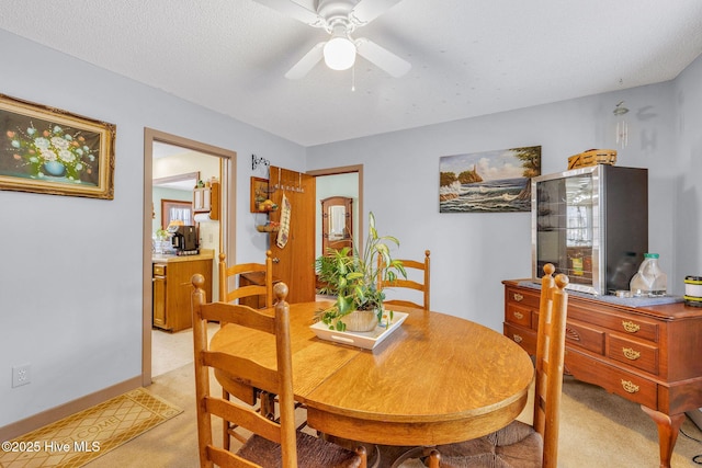 3421 Bethel Rd, Wilmington, NC 28409 - dining room featuring light carpet and ceiling fan
