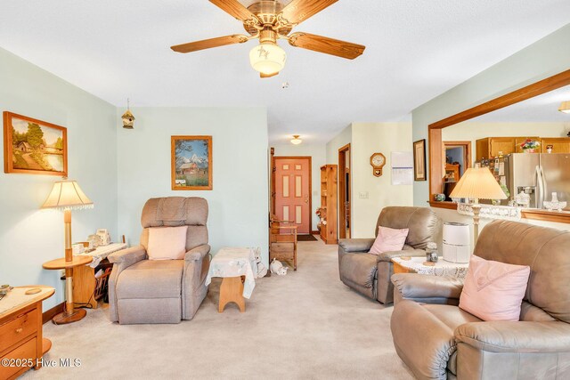 3421 Bethel Rd, Wilmington, NC 28409 - living area with light colored carpet and ceiling fan
