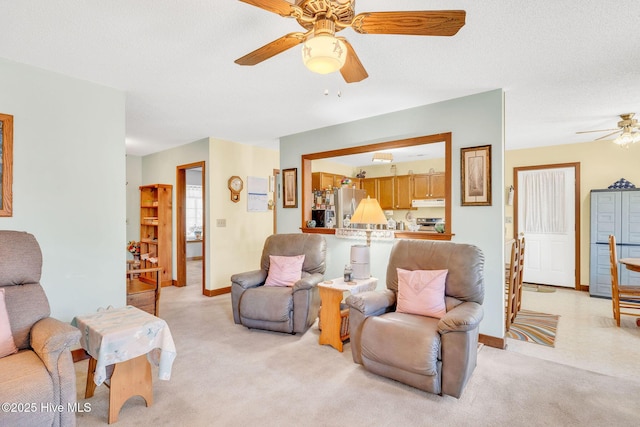 3421 Bethel Rd, Wilmington, NC 28409 - living area featuring light carpet, baseboards, and ceiling fan
