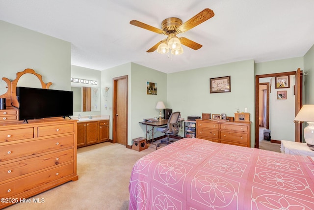 3421 Bethel Rd, Wilmington, NC 28409 - bedroom featuring connected bathroom, ceiling fan, and light carpet
