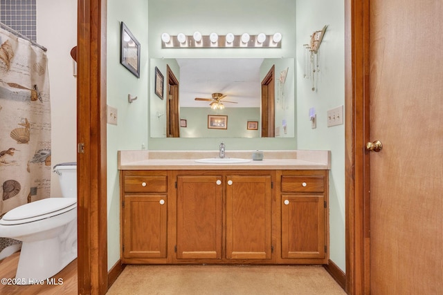 3421 Bethel Rd, Wilmington, NC 28409 - full bathroom featuring a ceiling fan, vanity, a shower with curtain, baseboards, and toilet