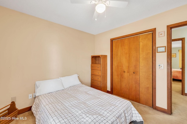 3421 Bethel Rd, Wilmington, NC 28409 - bedroom featuring light carpet, baseboards, a closet, and ceiling fan