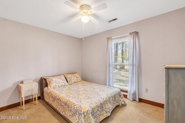 3421 Bethel Rd, Wilmington, NC 28409 - bedroom featuring baseboards, visible vents, light colored carpet, and ceiling fan