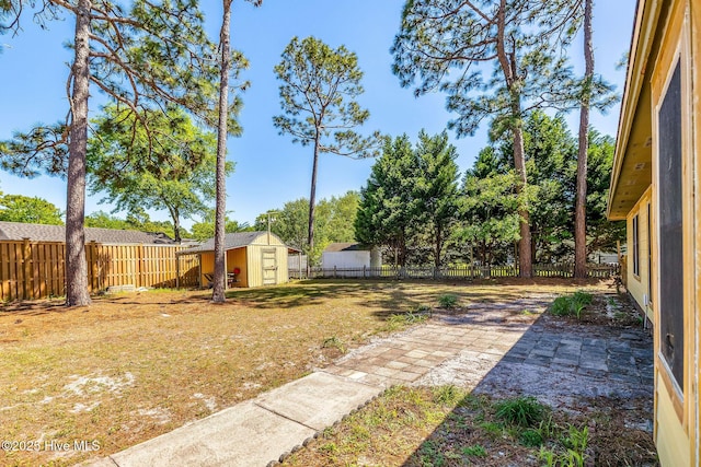 3421 Bethel Rd, Wilmington, NC 28409 - view of yard with a storage shed, an outbuilding, a patio, and a fenced backyard