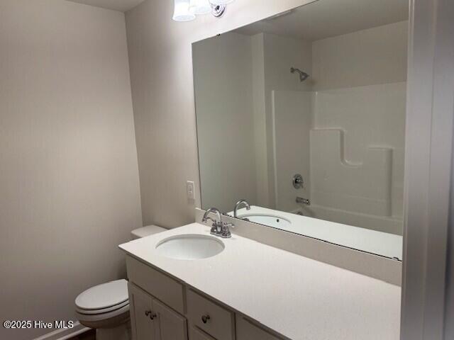 full bath featuring toilet and vanity