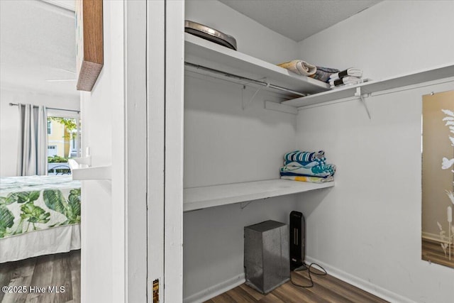 7501 E Oak Island Dr, Oak Island, NC 28465 - spacious closet featuring dark wood finished floors