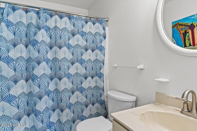 7501 E Oak Island Dr, Oak Island, NC 28465 - bathroom featuring toilet, a shower with curtain, and vanity