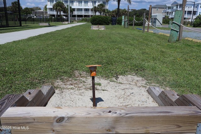 7501 E Oak Island Dr, Oak Island, NC 28465 - view of property's community featuring a lawn