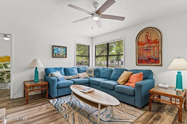 7501 E Oak Island Dr, Oak Island, NC 28465 - living area with a textured ceiling, ceiling fan, and wood finished floors