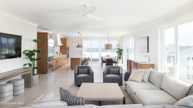 1800 Canal Dr Unit 401, Carolina Beach, NC 28428 - living room featuring ornamental molding and a ceiling fan